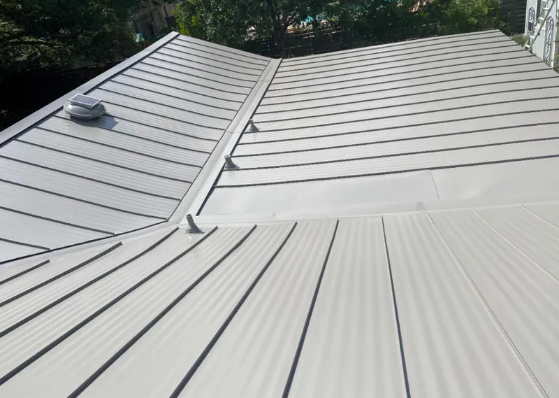 Solar attic fan installed on a metal roof for Roof Ventilation in Aptos